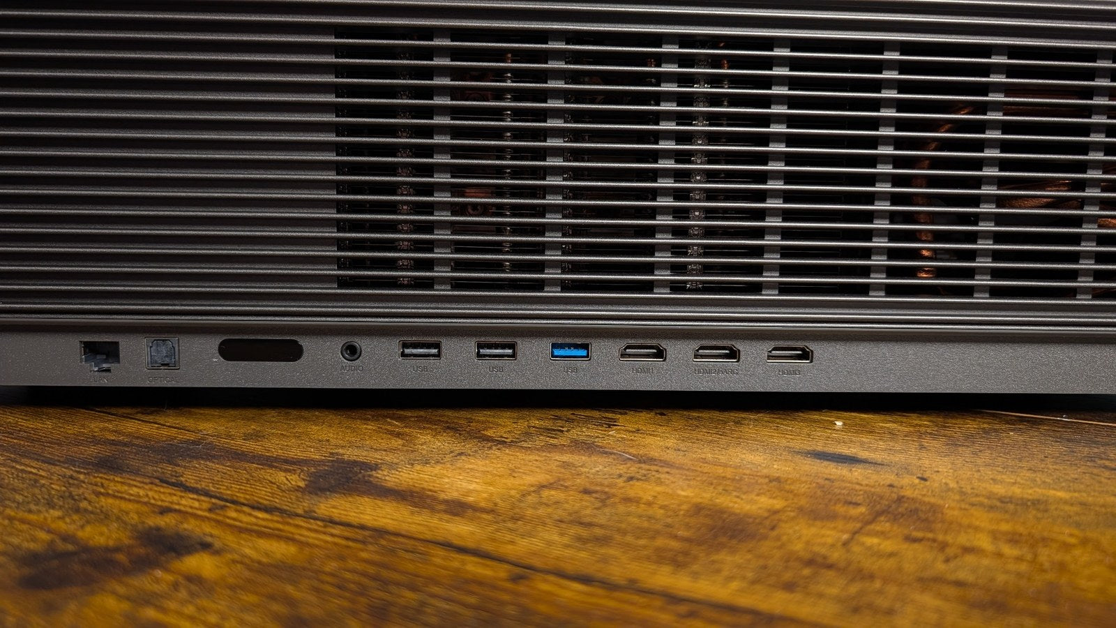 Rear input panel on the XGIMI Aura 3 Max showing Ethernet, optical audio, USB and HDMI ports