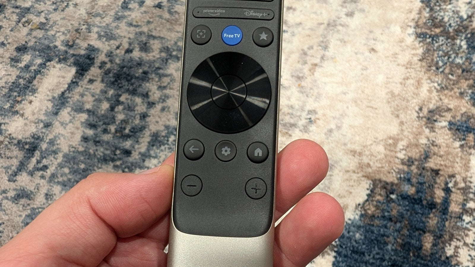 Lower half of the XGIMI Aura 3 Max remote showing navigation, settings, home and volume buttons